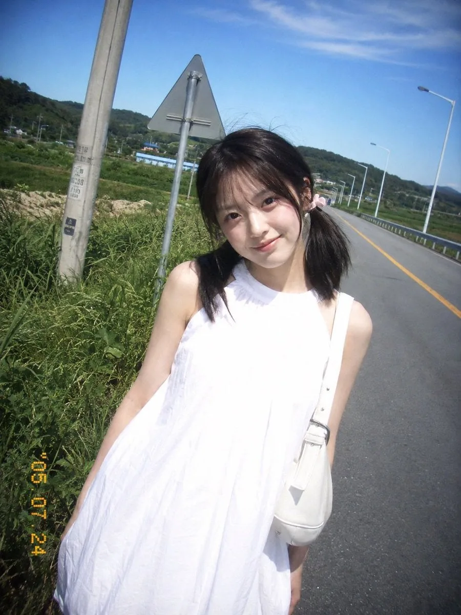 A summer travel capture using a retro CCD card machine shows a young …