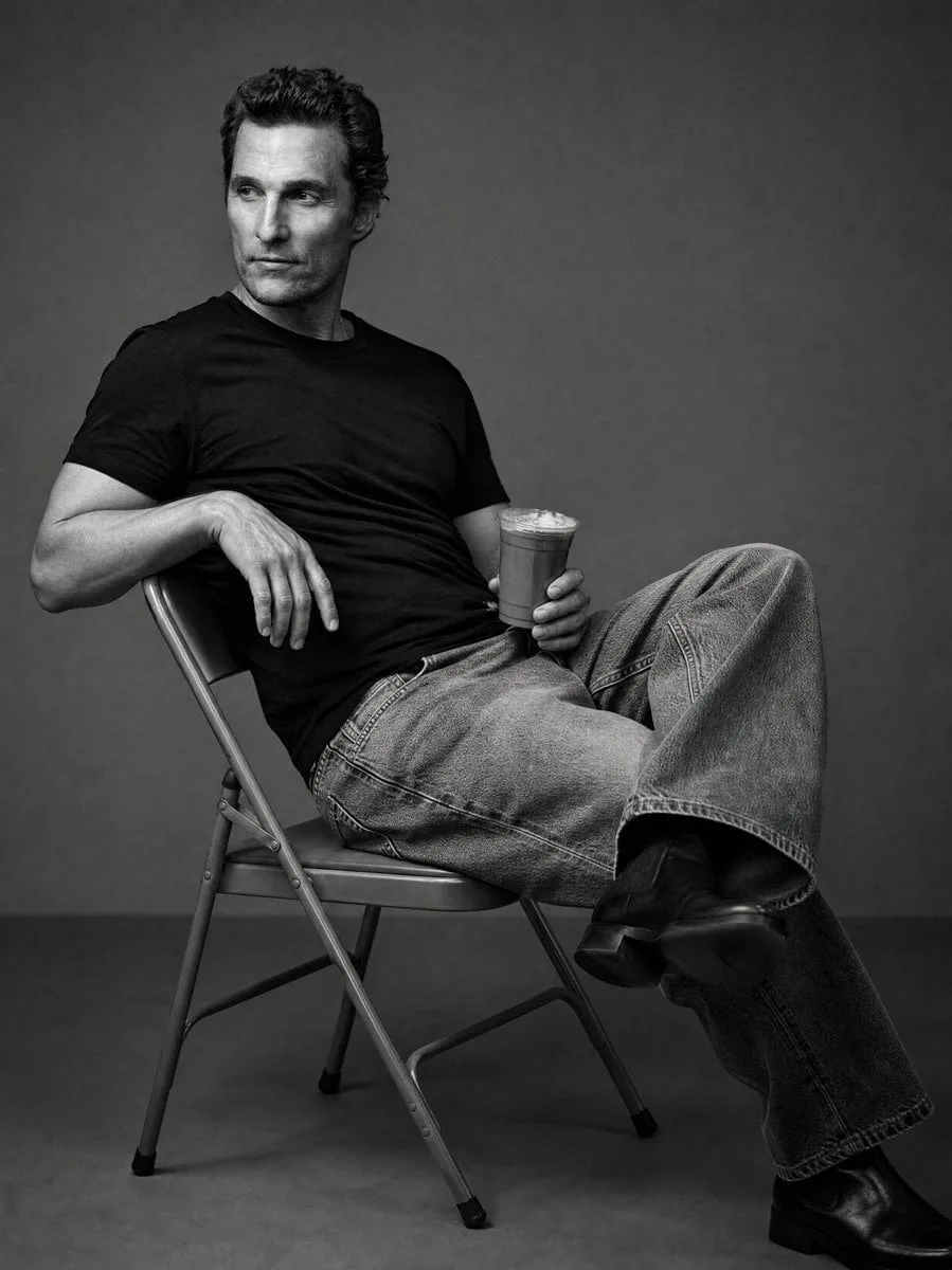 Create a black and white studio image of the person in th...