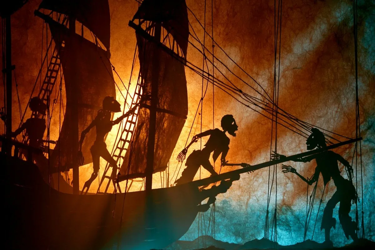 A theatrical shadow puppet scene of a [Subject], shown in...