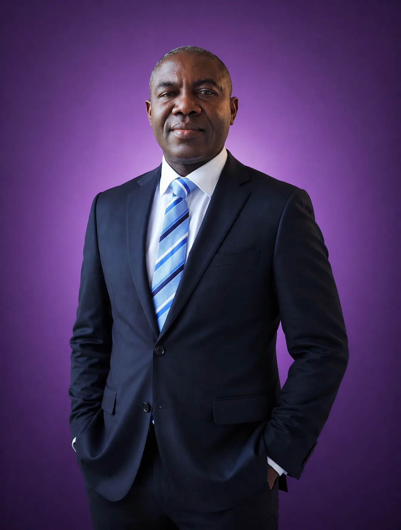 A professional middle-aged man with a dark complexion sta...